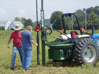 Tom Kilcer helping a farmer