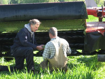 Tom Kilcer helping a farmer